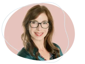 Professional portrait of Cheryl Dillon smiling confidently while seated at a mediation table, symbolizing expertise and empathy. Looking for compassionate guidance through your divorce? Call Equitable Mediation at (877) 732-6682 to connect with Cheryl today.