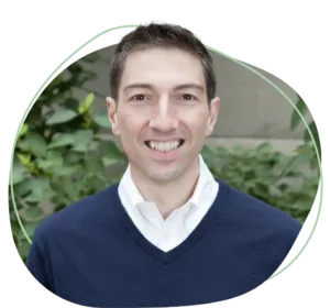 Meet Joe Dillon | Equitable Mediation Professional portrait of mediator Joe Dillon seated at a conference table with a warm, reassuring smile, ready to guide you through an amicable divorce process. For compassionate support, call Equitable Mediation at (877) 732-6682 today.